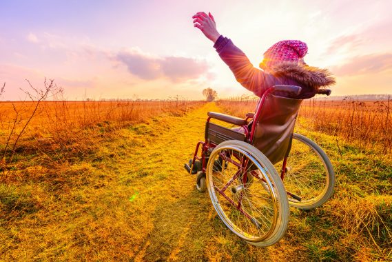 Happy,Woman,At,Sunset.,A,Young,Girl,In,A,Wheelchair